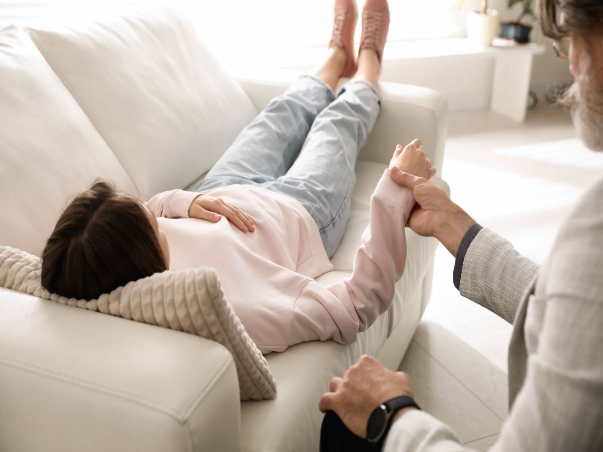 Client in hypnotic regression therapy session with Dr. Kelly Yi